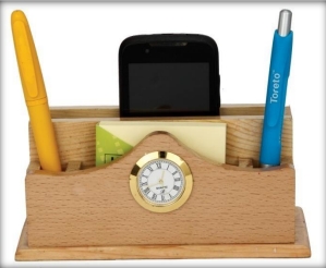 wooden table top clock with pen and mobile