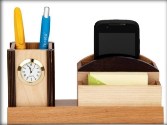 wooden table top clock attached with pen and mobile 