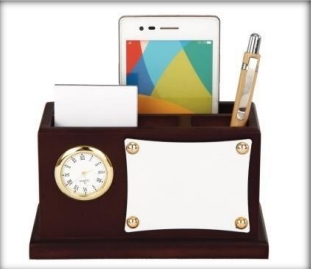 wooden table top clock with pen and card and mobile